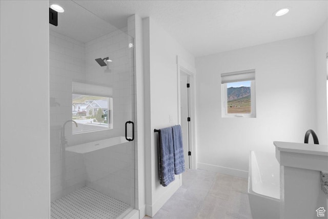 469 N 1360 E Unit 13, Tooele, UT 84074 - full bathroom featuring a shower stall, healthy amount of natural light, a freestanding tub, and recessed lighting
