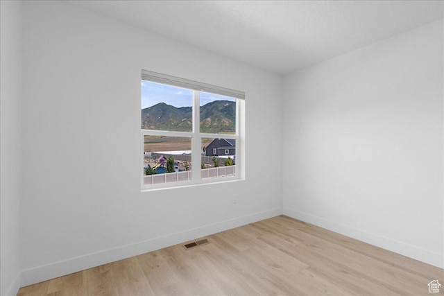 469 N 1360 E Unit 13, Tooele, UT 84074 - empty room featuring light wood-type flooring and a mountain view