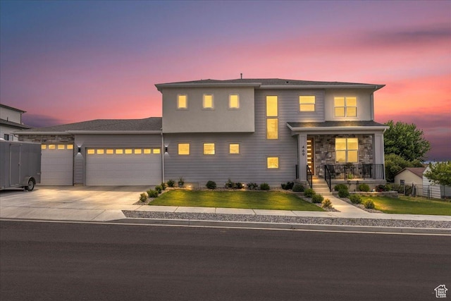 469 N 1360 E Unit 13, Tooele, UT 84074 - view of front facade featuring an attached garage, covered porch, and concrete driveway