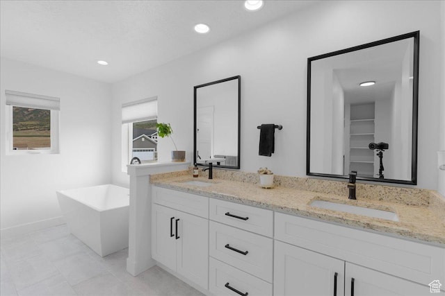 469 N 1360 E Unit 13, Tooele, UT 84074 - bathroom with double vanity, a soaking tub, tile patterned floors, and recessed lighting