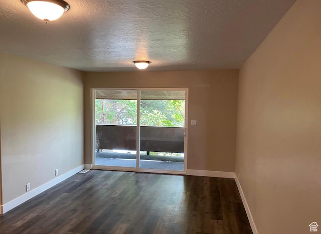 241 W Garden Park, Orem, UT 84057 - unfurnished room with a textured ceiling and dark wood finished floors