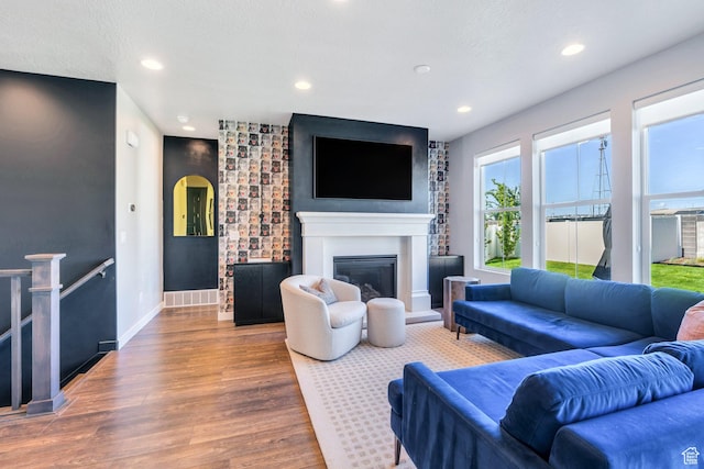 2739 N 3550 W, Lehi, UT 84043 - living area with wood finished floors, a glass covered fireplace, and recessed lighting