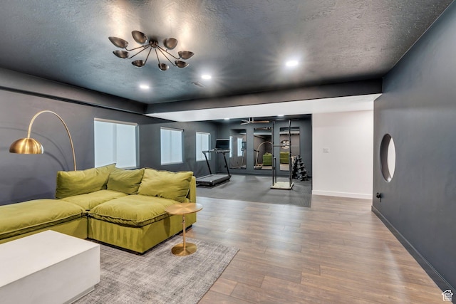 2739 N 3550 W, Lehi, UT 84043 - living room with wood finished floors, a textured ceiling, a chandelier, and recessed lighting