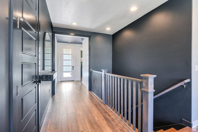 2739 N 3550 W, Lehi, UT 84043 - hallway with an upstairs landing, wood finished floors, a textured ceiling, and recessed lighting