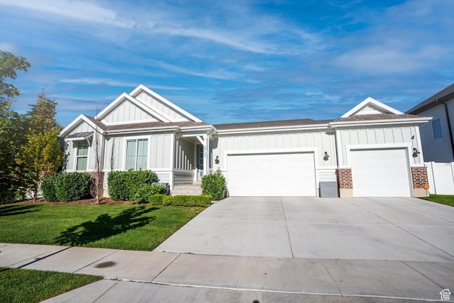 2739 N 3550 W, Lehi, UT 84043 - view of front of home with board and batten siding, an attached garage, a front yard, driveway, and a shingled roof
