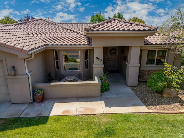 960 N Catalpa Dr, Washington, UT 84780 - view of front of home with stucco siding and a tiled roof