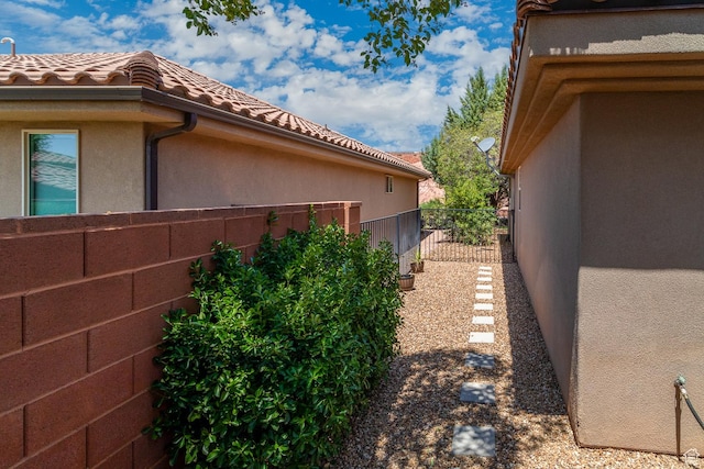 960 N Catalpa Dr, Washington, UT 84780 - view of side of home featuring a tiled roof and stucco siding