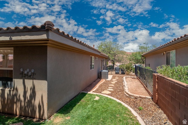 960 N Catalpa Dr, Washington, UT 84780 - view of side of home featuring stucco siding and a tiled roof