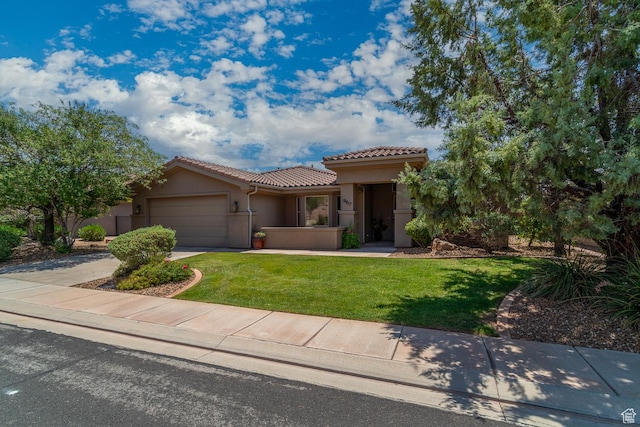 960 N Catalpa Dr, Washington, UT 84780 - mediterranean / spanish-style house with a tile roof, a garage, stucco siding, a front lawn, and driveway