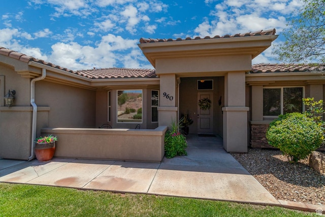 960 N Catalpa Dr, Washington, UT 84780 - property entrance featuring a tile roof and stucco siding