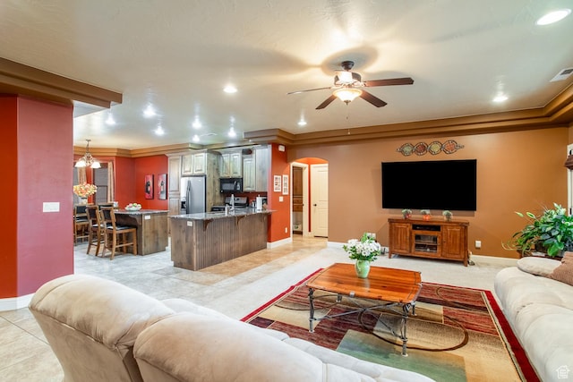 960 N Catalpa Dr, Washington, UT 84780 - living area featuring arched walkways, ceiling fan, recessed lighting, ornamental molding, and light tile patterned flooring
