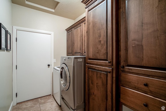 960 N Catalpa Dr, Washington, UT 84780 - washroom with cabinet space, attic access, washing machine and clothes dryer, and light tile patterned floors