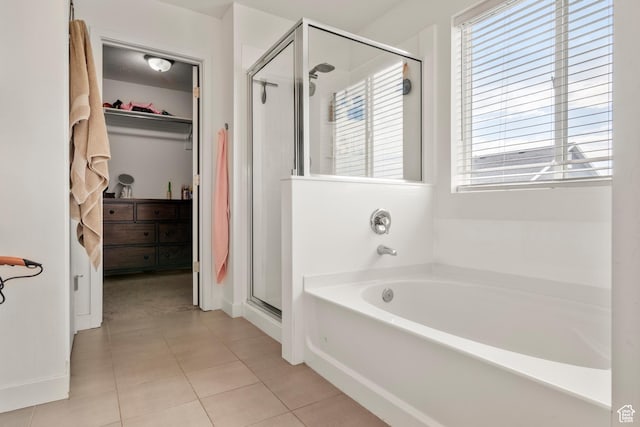 1546 W Parkview Dr, Syracuse, UT 84075 - bathroom featuring a stall shower, a garden tub, a walk in closet, and tile patterned flooring