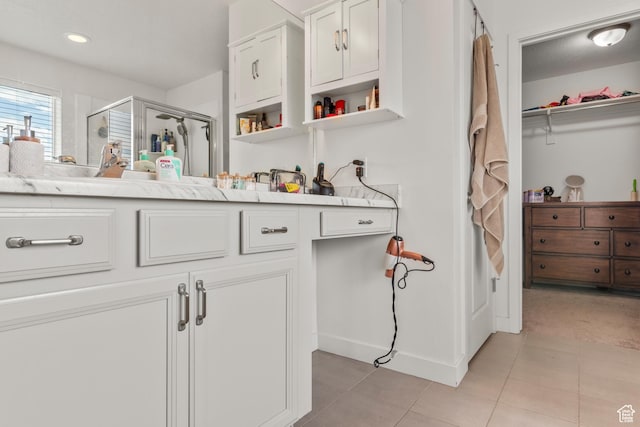1546 W Parkview Dr, Syracuse, UT 84075 - full bathroom with a stall shower, vanity, tile patterned floors, and a walk in closet