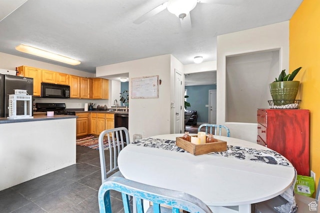3364 E Dornock Dr, Eagle Mountain, UT 84005 - dining space with a ceiling fan and dark tile patterned floors