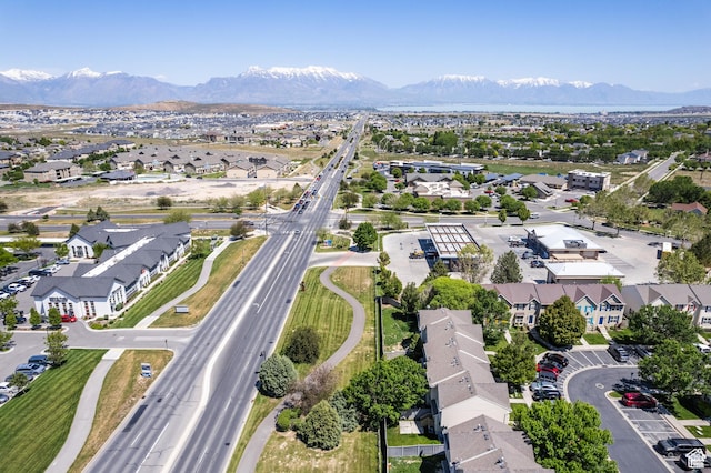 3364 E Dornock Dr, Eagle Mountain, UT 84005 - aerial view of residential area featuring a mountainous background and a highway