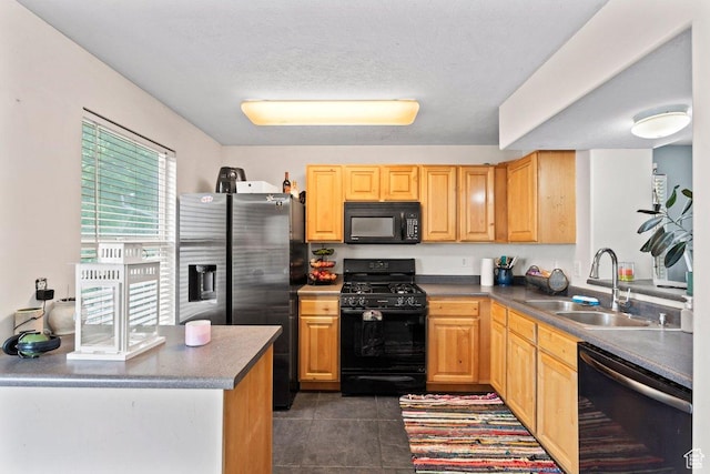 3364 E Dornock Dr, Eagle Mountain, UT 84005 - kitchen with black appliances, dark tile patterned floors, light brown cabinets, and a textured ceiling