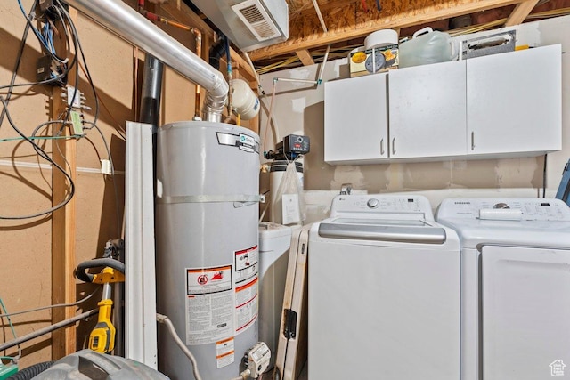 3364 E Dornock Dr, Eagle Mountain, UT 84005 - washroom with strapped water heater, cabinet space, and washing machine and clothes dryer