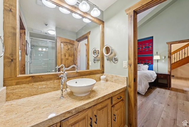 1582 Deer Valley Dr N, Park City, UT 84060 - ensuite bathroom with vanity, a stall shower, and wood finished floors