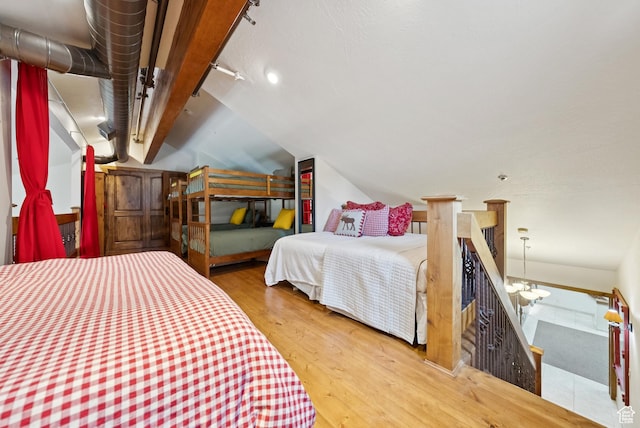 1582 Deer Valley Dr N, Park City, UT 84060 - bedroom featuring wood finished floors, lofted ceiling, and track lighting