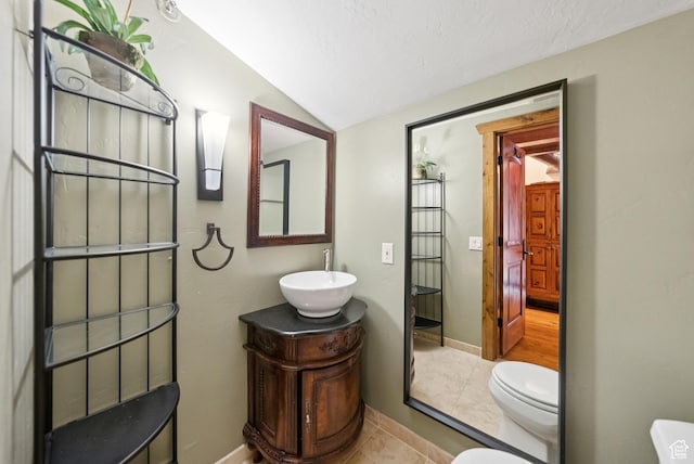 1582 Deer Valley Dr N, Park City, UT 84060 - bathroom with lofted ceiling, vanity, tile patterned flooring, and a textured ceiling