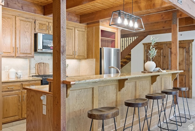 1582 Deer Valley Dr N, Park City, UT 84060 - kitchen with appliances with stainless steel finishes, a wood ceiling with exposed beams, backsplash, a kitchen breakfast bar, and decorative light fixtures