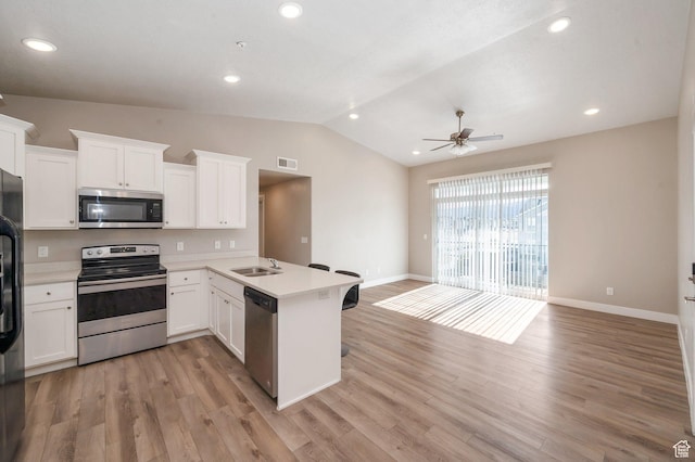 1128 S 820 E Unit 1303, Heber City, UT 84032 - kitchen featuring stainless steel appliances, a peninsula, vaulted ceiling, a ceiling fan, and light countertops