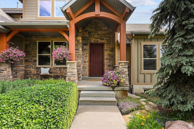 4048 W Ivy Ave, Mountain Green, UT 84050 - doorway to property featuring stone siding and roof with shingles