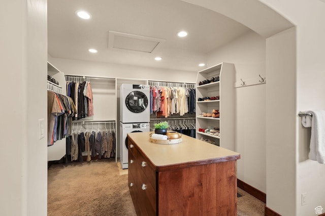 4048 W Ivy Ave, Mountain Green, UT 84050 - spacious closet featuring stacked washer / dryer, attic access, light carpet, and arched walkways