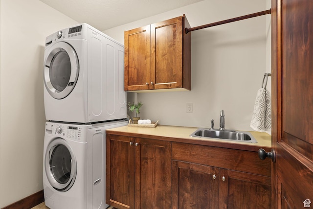 4048 W Ivy Ave, Mountain Green, UT 84050 - laundry area with stacked washer and clothes dryer and cabinet space