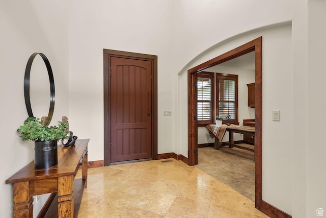 4048 W Ivy Ave, Mountain Green, UT 84050 - entryway with baseboards and light stone finish flooring