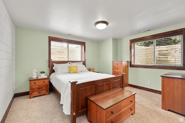 4048 W Ivy Ave, Mountain Green, UT 84050 - bedroom featuring multiple windows and light carpet