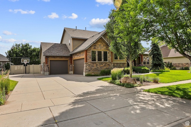 4048 W Ivy Ave, Mountain Green, UT 84050 - view of front of home with an attached garage, stone siding, driveway, and roof with shingles
