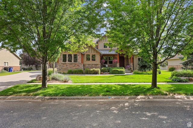4048 W Ivy Ave, Mountain Green, UT 84050 - view of front of property featuring stone siding, board and batten siding, and a front yard