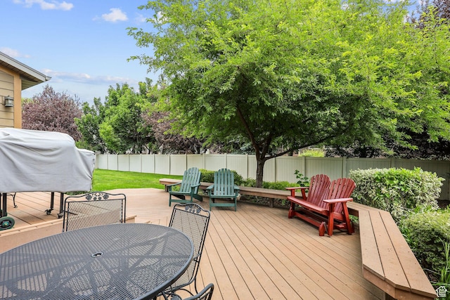 4048 W Ivy Ave, Mountain Green, UT 84050 - wooden deck with a fenced backyard, outdoor dining area, and grilling area