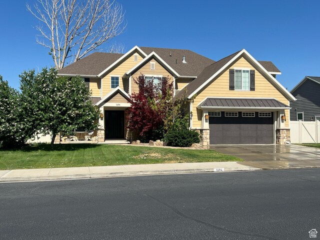 1694 S 710 E, Lehi, UT 84043 - craftsman-style home with driveway, stone siding, an attached garage, and roof with shingles