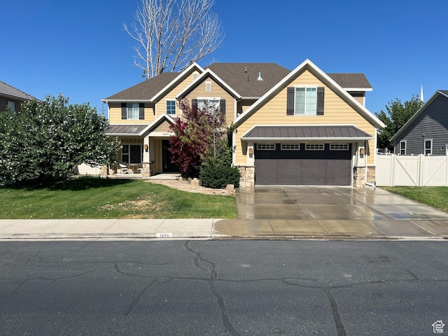 1694 S 710 E, Lehi, UT 84043 - craftsman-style home with a standing seam roof, concrete driveway, stone siding, an attached garage, and a metal roof