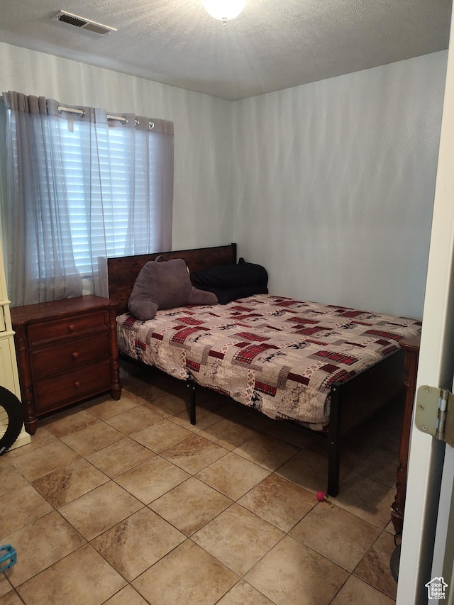 2054 E 140 S, St George, UT 84790 - bedroom featuring a textured ceiling and light tile patterned floors
