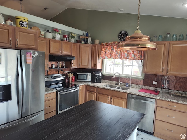 2054 E 140 S, St George, UT 84790 - kitchen with stainless steel appliances, under cabinet range hood, backsplash, lofted ceiling, and light stone countertops