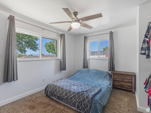 7645 W Gardenia Ave, Magna, UT 84044 - carpeted bedroom featuring baseboards and a ceiling fan