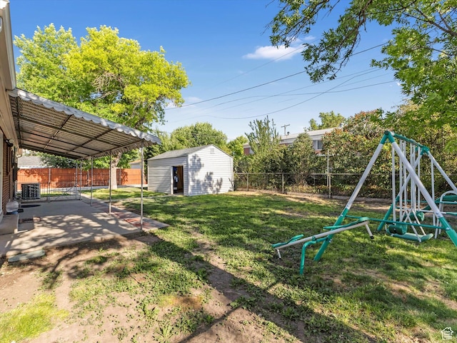 7645 W Gardenia Ave, Magna, UT 84044 - fenced backyard featuring a playground, a patio area, and a shed