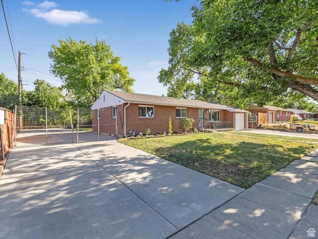 7645 W Gardenia Ave, Magna, UT 84044 - single story home featuring brick siding, driveway, and a gate