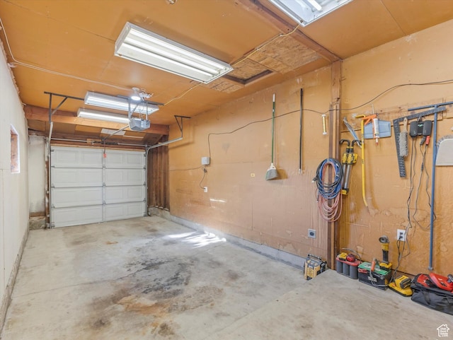 7645 W Gardenia Ave, Magna, UT 84044 - garage featuring a garage door opener