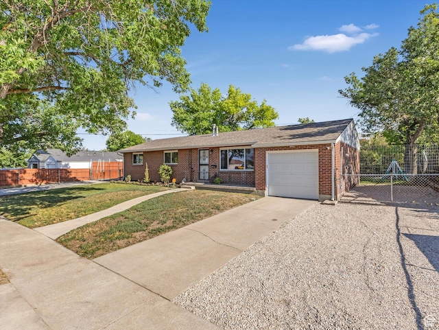 7645 W Gardenia Ave, Magna, UT 84044 - ranch-style house with a garage, driveway, brick siding, and solar panels