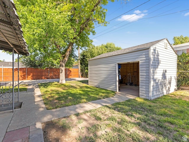 7645 W Gardenia Ave, Magna, UT 84044 - view of yard featuring a garage and an outbuilding