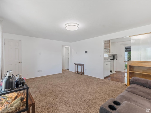 7645 W Gardenia Ave, Magna, UT 84044 - living room featuring dark colored carpet