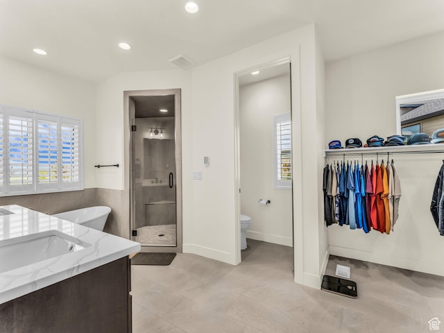 943 Hart Loop, Francis, UT 84036 - bathroom with a shower stall, a walk in closet, recessed lighting, a soaking tub, and vanity