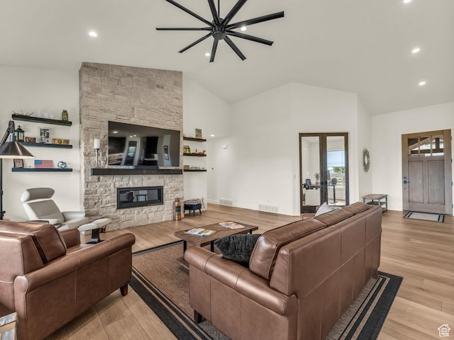 943 Hart Loop, Francis, UT 84036 - living room with a fireplace, light wood-type flooring, french doors, high vaulted ceiling, and recessed lighting