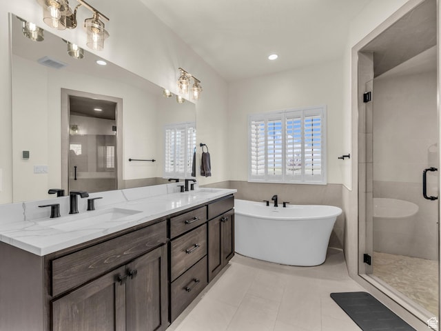 943 Hart Loop, Francis, UT 84036 - full bath featuring double vanity, a shower stall, a freestanding bath, tile patterned floors, and recessed lighting