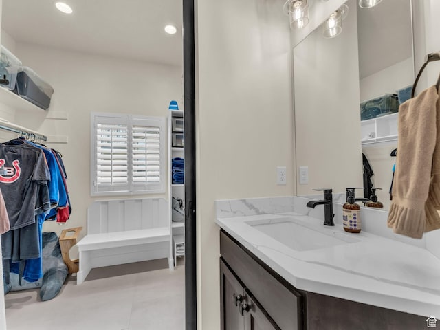 943 Hart Loop, Francis, UT 84036 - bathroom with vanity, a walk in closet, and recessed lighting